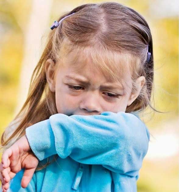 Sick child coughing into elbow - Covid-19 Vaccine Information